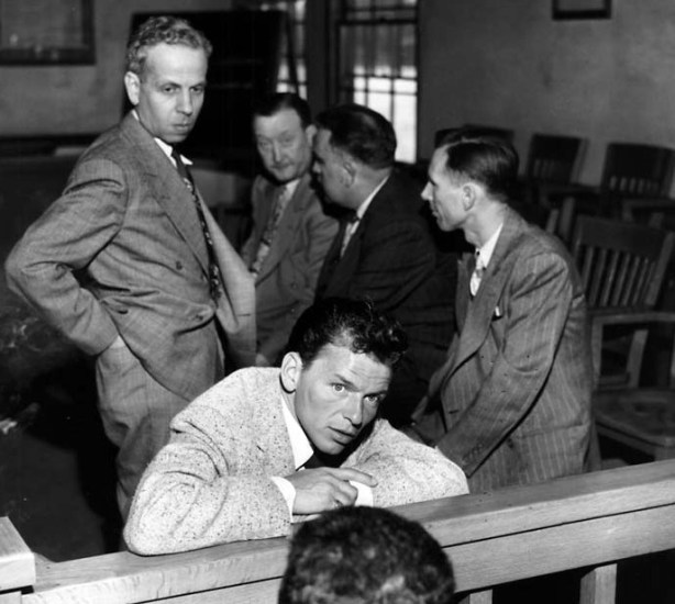 April 10, 1047 file photo of Frank Sinatra in  Beverley Hills Municipal Court, in full view of his glaring accuser,  after being arrested on battery charges for slugging New York columnist Lee Mortimer. Los Angeles Times staff archive photo. Photo appears in Los Angeles Times book "High Exposure: Hollywood Lives - Found Photos from the archives of the Los Angeles Times.