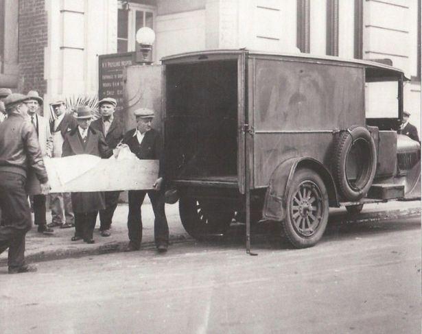 Body of A.R. being taken away, 1928.
